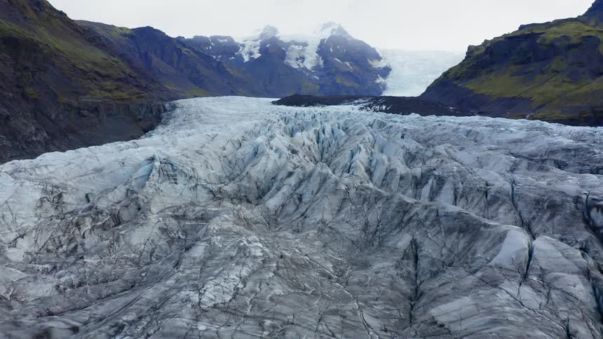 Ridges of ice with mountains on either side