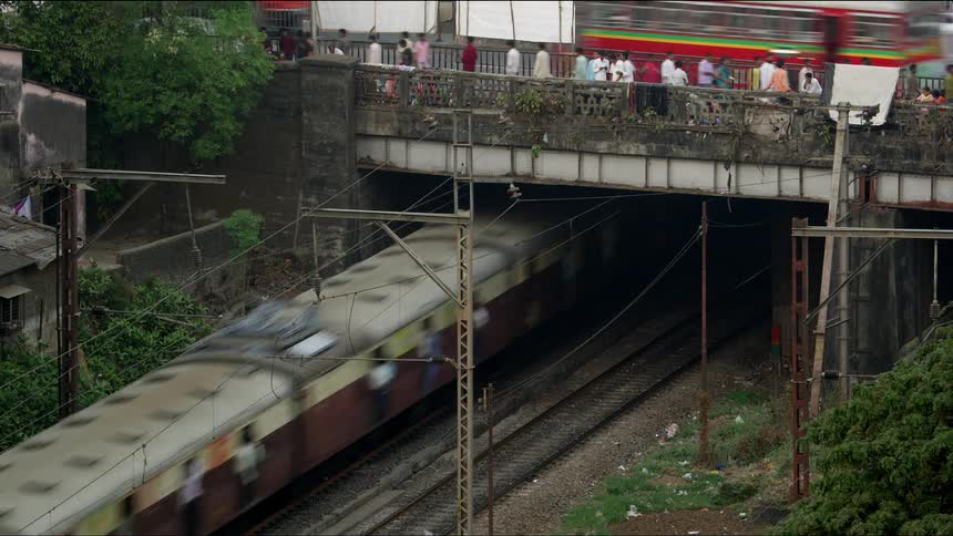 Time lapse of a train and pedestrians in a city