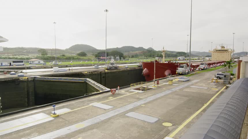 A ship prepares to move through a canal