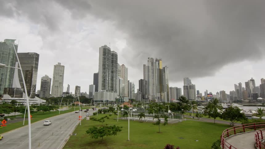 Dark clouds cover a city and highway