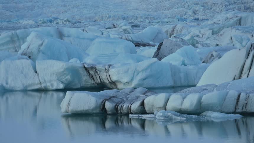 A body of water with icebergs