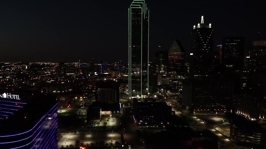 A downtown urban area lit up at night