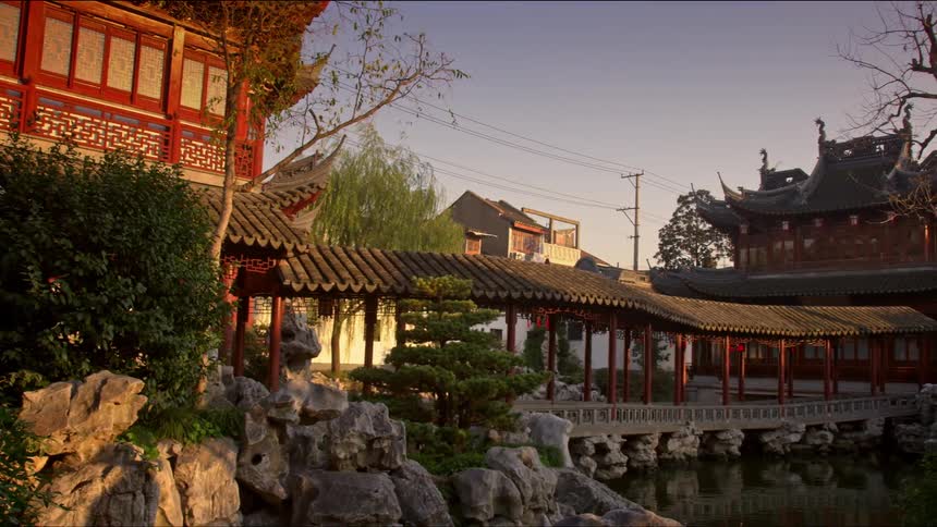 Woman walks on a walkway in a city in the orient