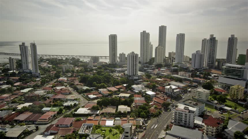 Traffic and people move through the neighborhoods and downtown area of a city