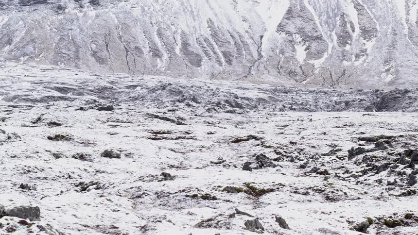 Rugged barren winter landscape in mountain valley