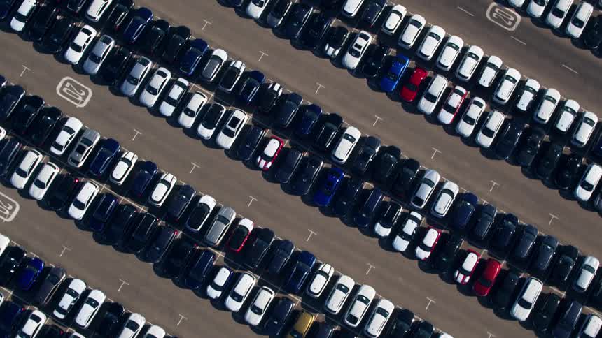 Rows of vehicles lined up in a parking lot