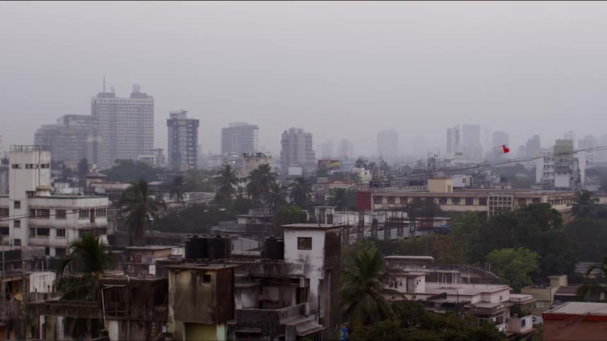A city skyline with a neighborhood and downtown area in the distance