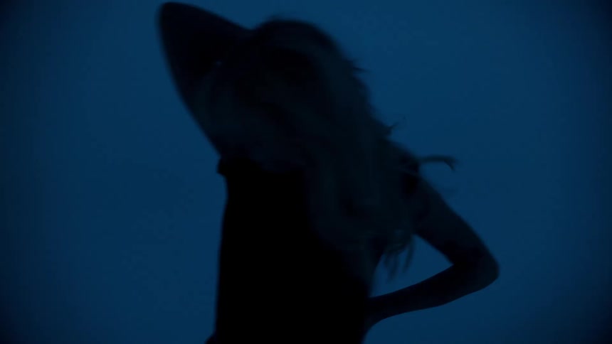 A teenager moves during a photo shoot