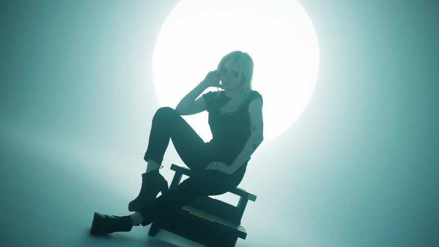 A teenager poses for a photshoot
