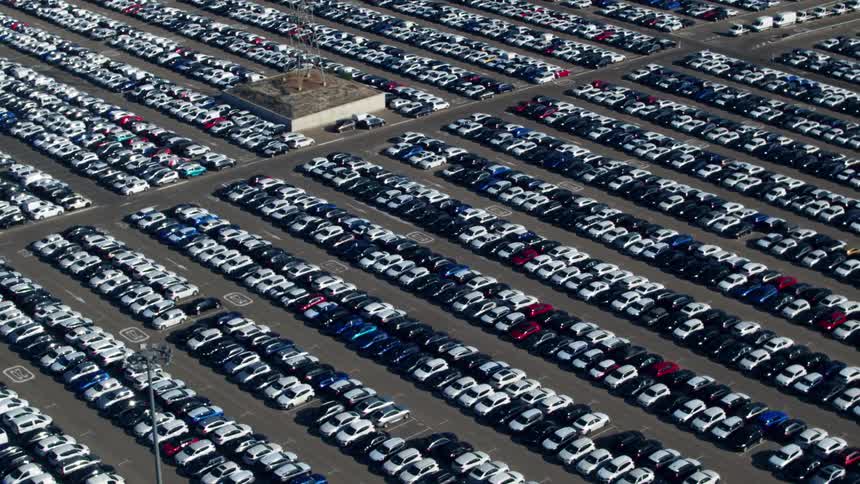 Aerial view of large parking lot filled with cars