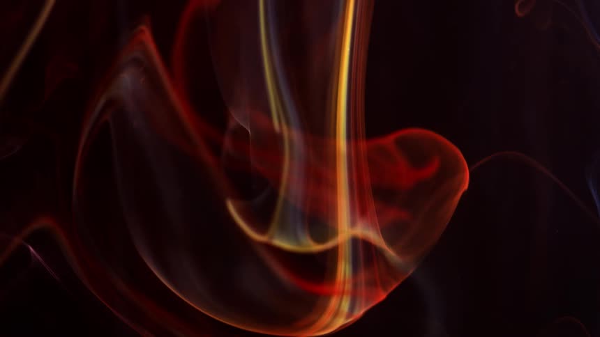 Multicolored tendrils of smoke move about