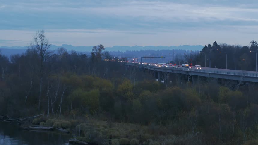 Revealing early morning commuter traffic flowing along an elevated causeway