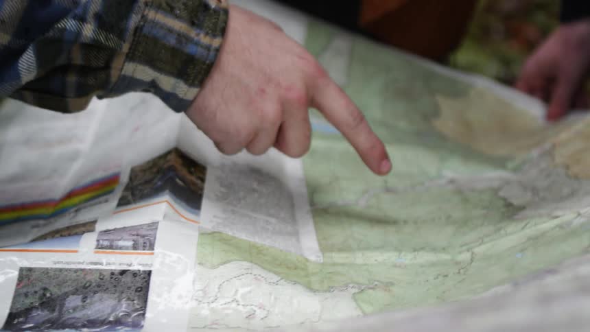 People pointing at a map