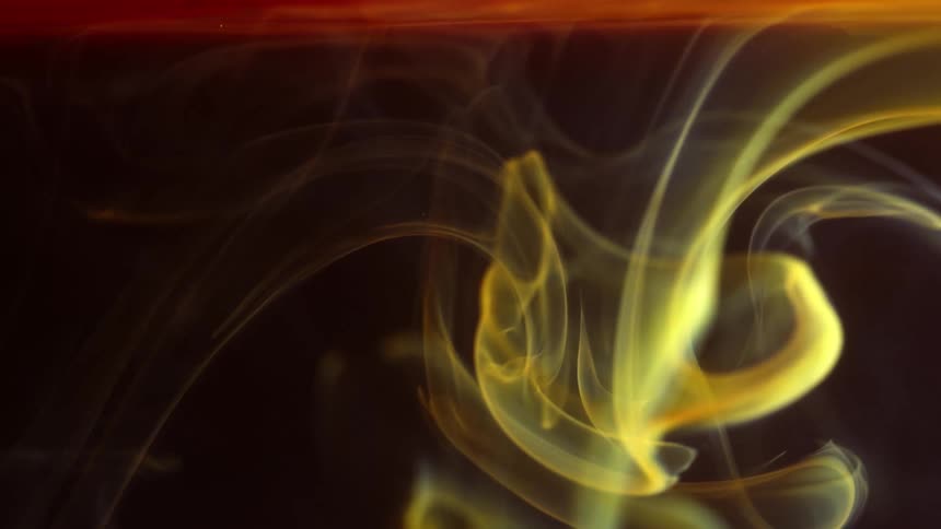 Digital art of yellow coloring mixed with purple and red and slowly forming a swirl pattern