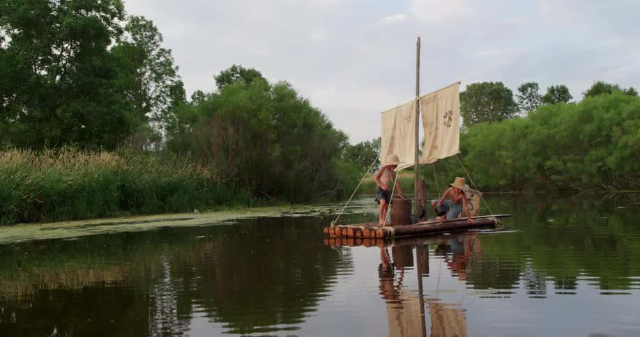 The people sit on the raft in the water