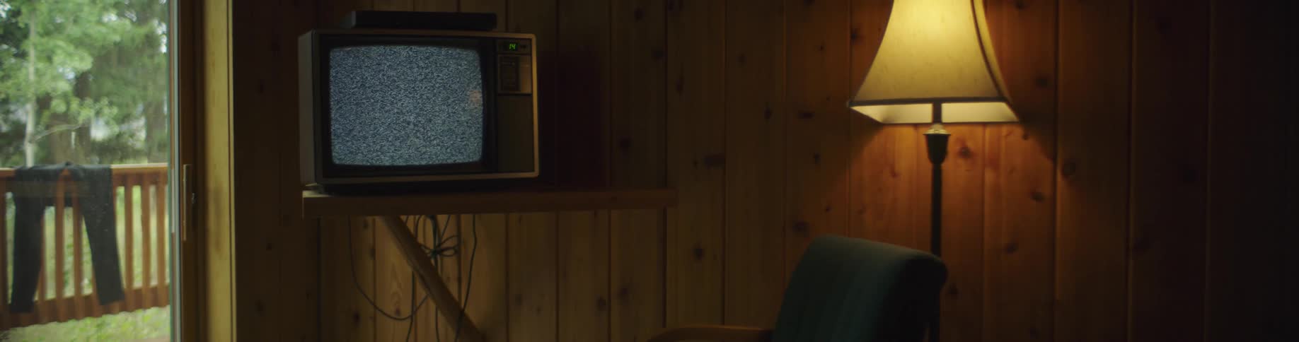 A television with a fuzzy screen in a living room