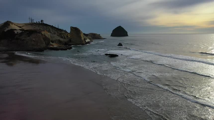 Ocean waves are moving towards the beach coast