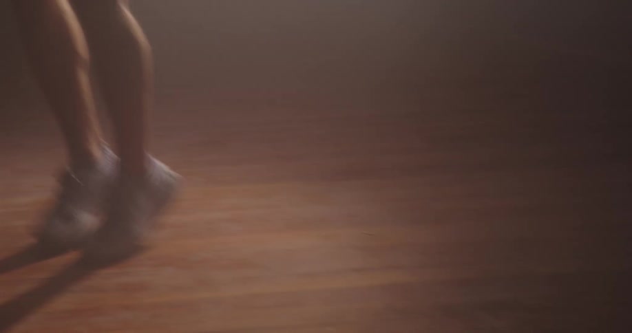 A person jumps up and down for exercise
