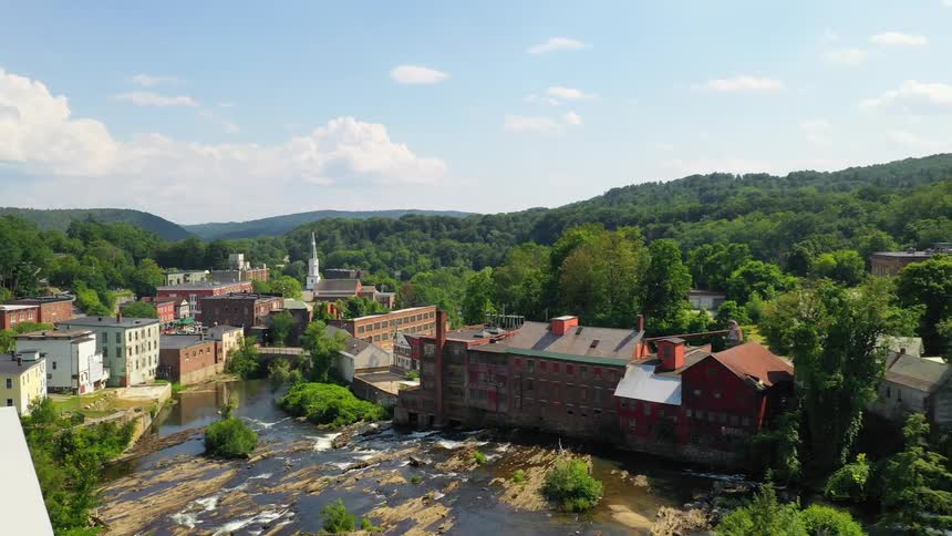 Small town along river in mountains