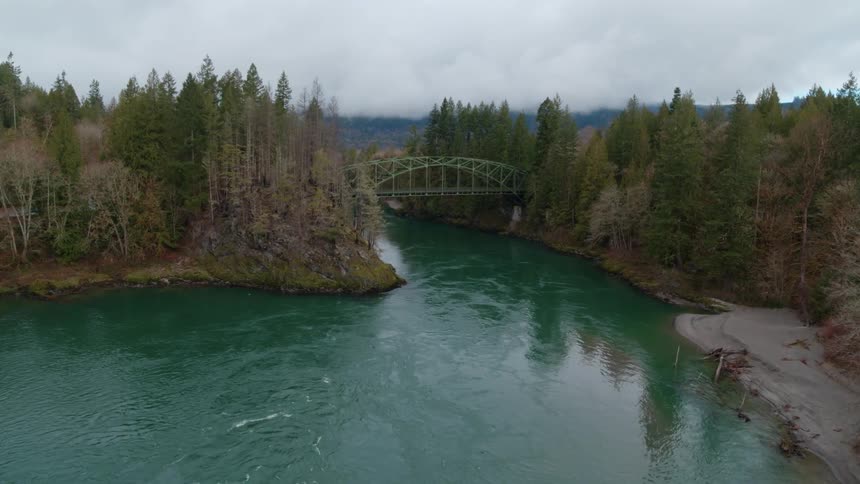 An aerial view of a lake is displayed