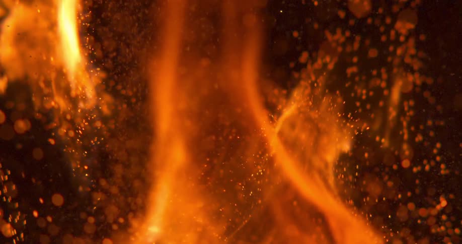 Flames and sparks erupt into the sky