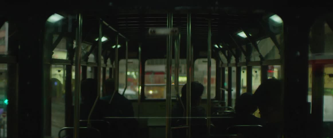 People sitting in a bus in the city