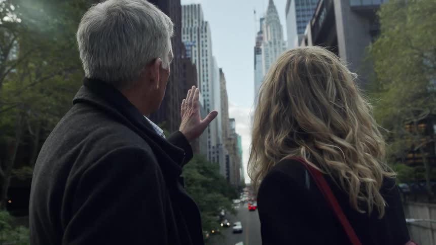 The man talks to the woman
