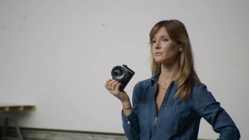 Photographer stops for a moment to discuss and think