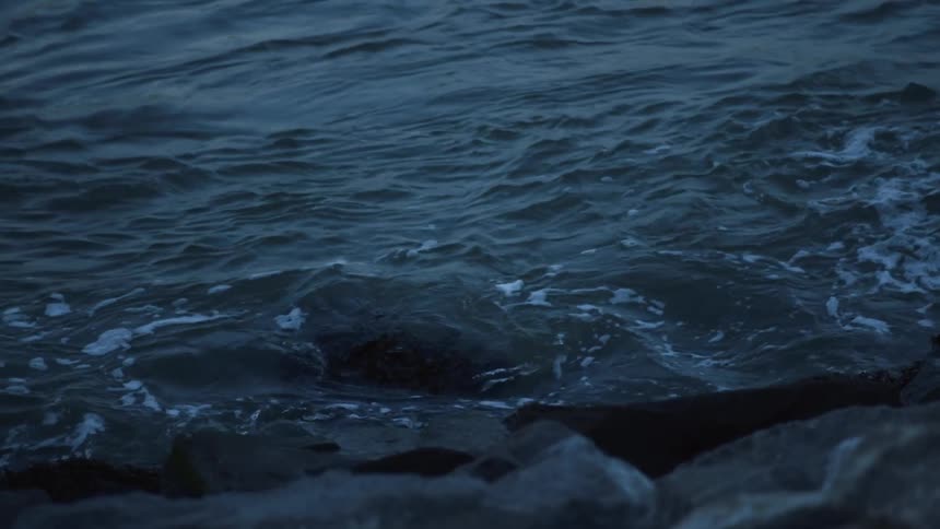 Waves crashing in to the rocks on the shore