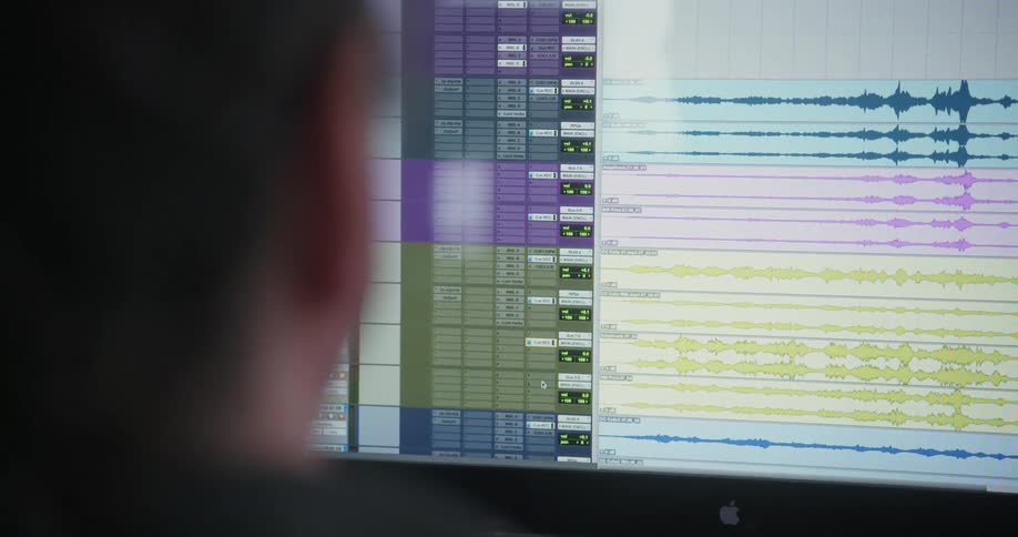 A white male uses software on a computer