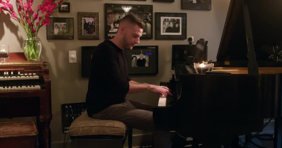 The man plays the piano