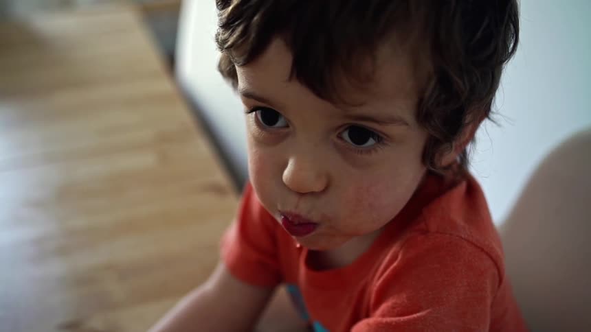 Slow motion video of toddler chewing food