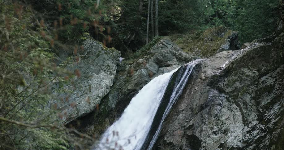 A waterfall with trees in the background