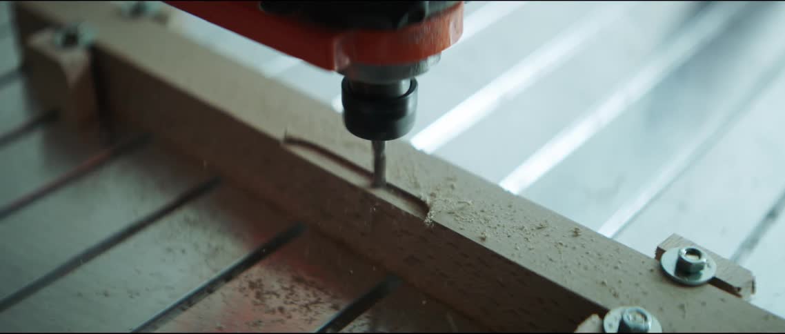 A drill drilling wood