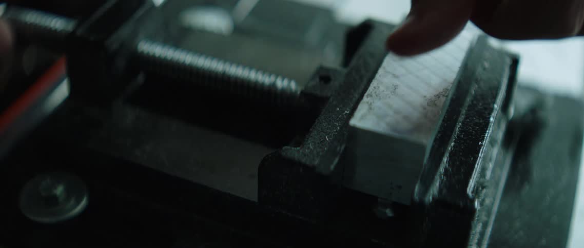 Metal block placed in vice grip