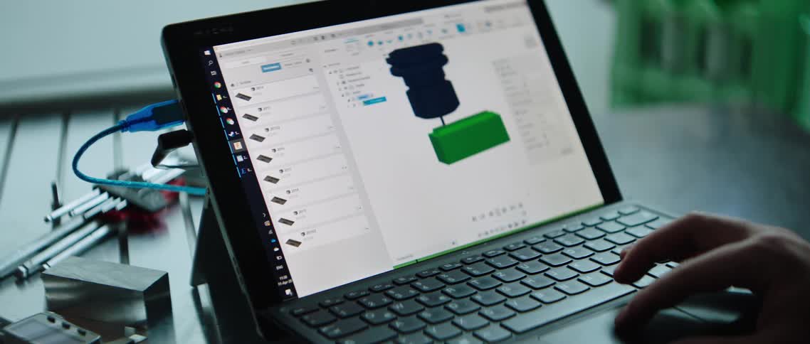 Person making 3d printing design on laptop