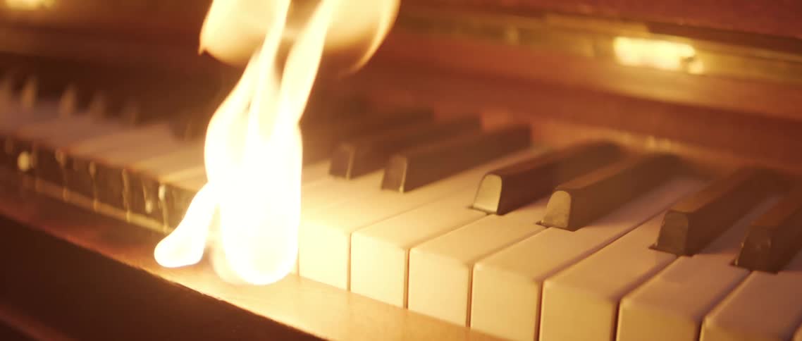 Flame burning on piano keys