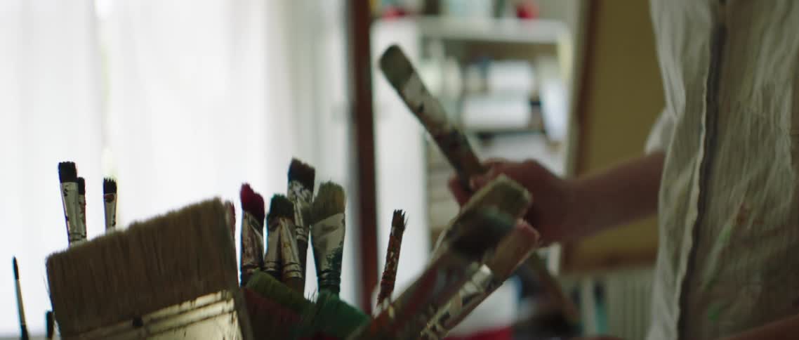 An artist gets a paintbrush out