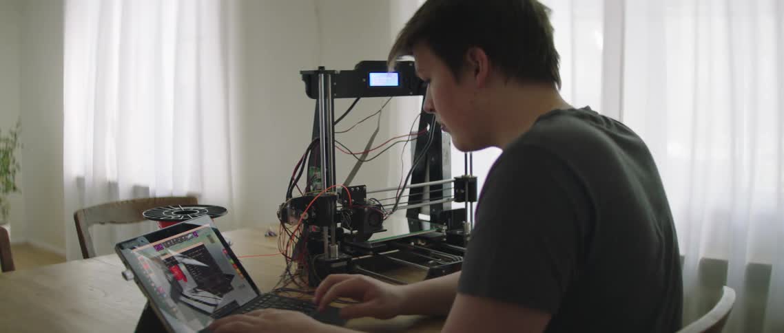 The man works on the laptop