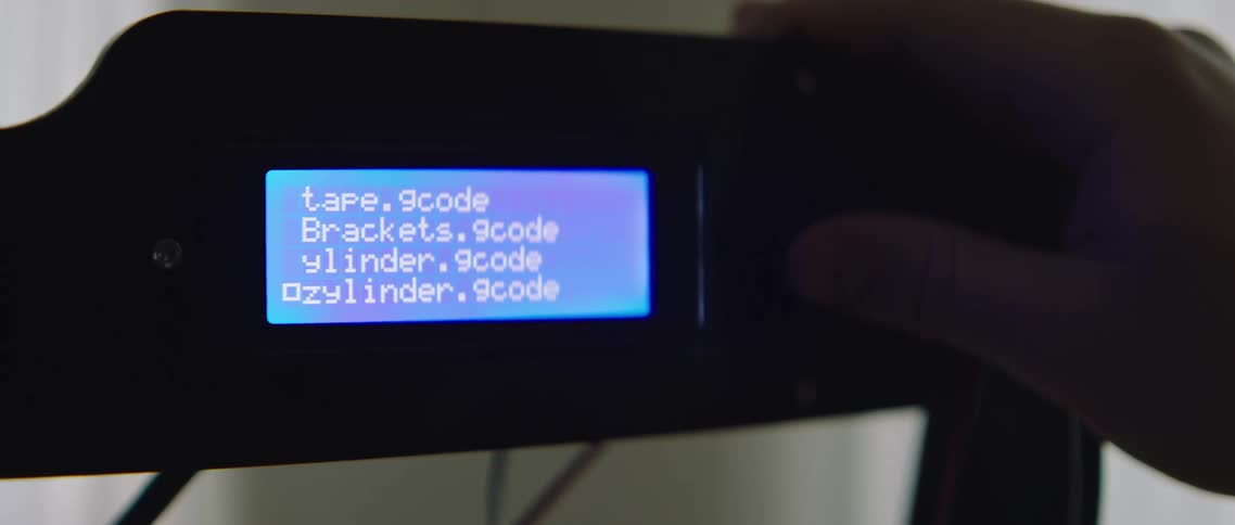 A man pushes a button to scroll through text on a screen