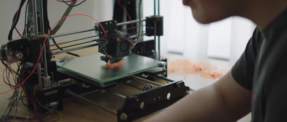 Person using 3d printer
