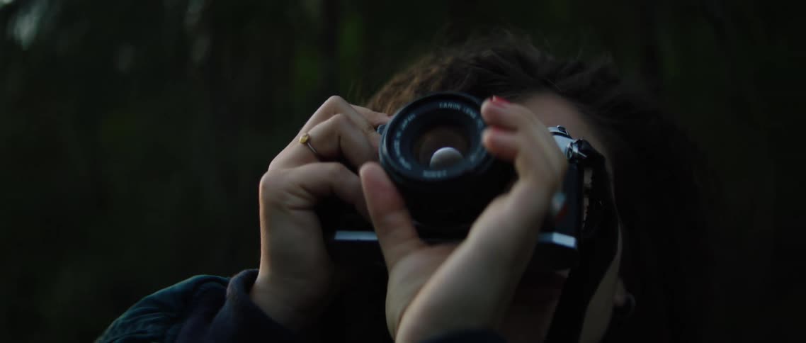A photographer takes pictures outside