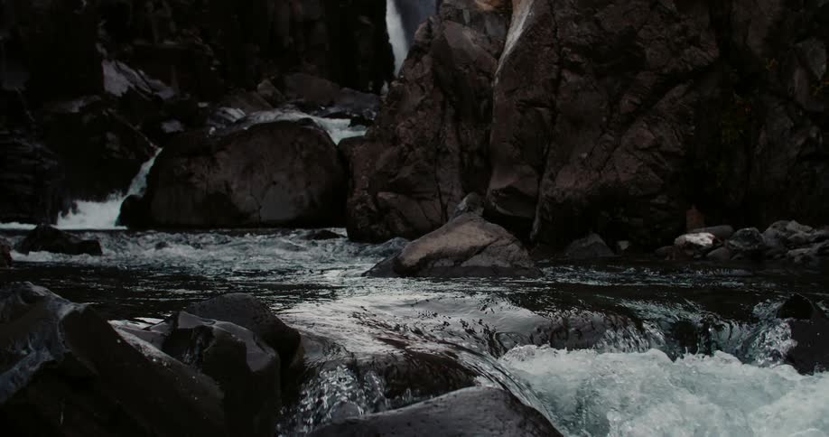 A stream rushes through a rocky ravine