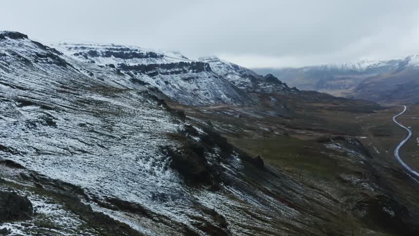 Aerial view of snow capped mountain slopes
