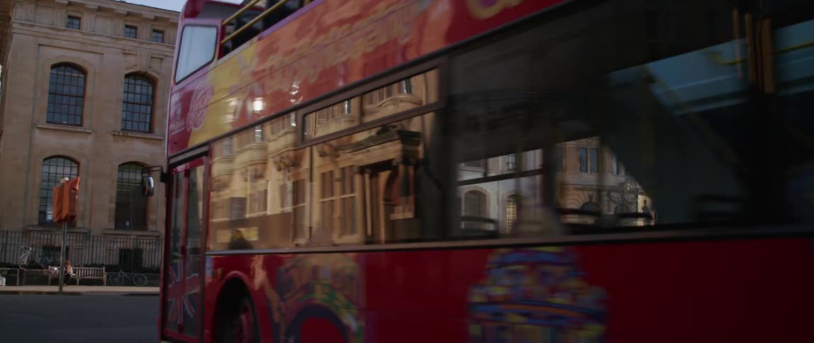 People and vehicles on a city street in Oxford England