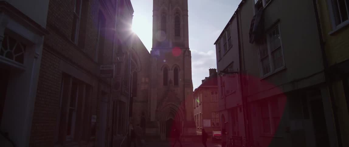 European city neighborhood street with church spire