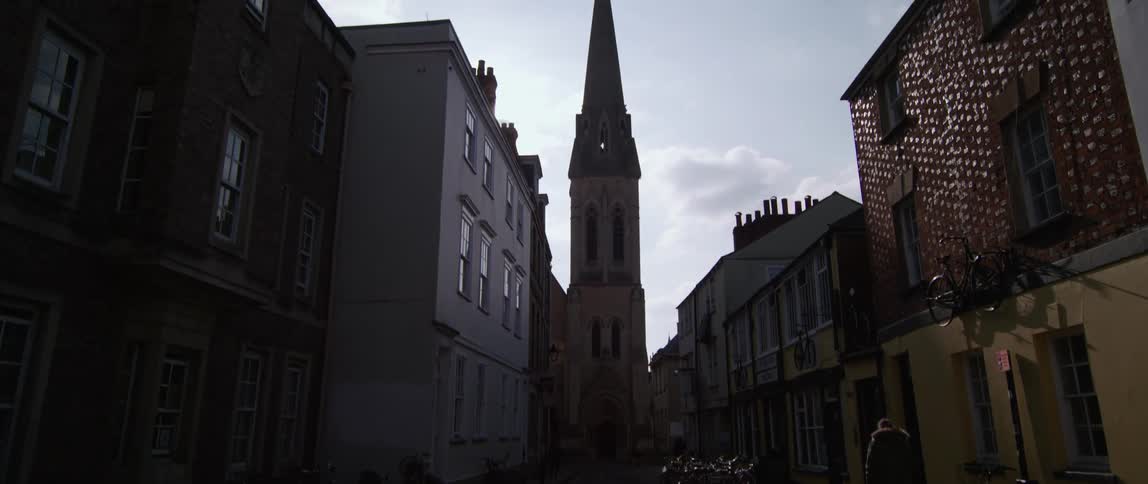 A man walks down a city street