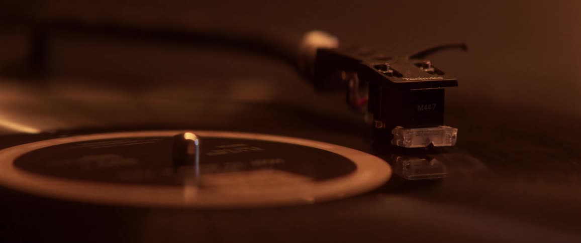 An album is played on a retro record player