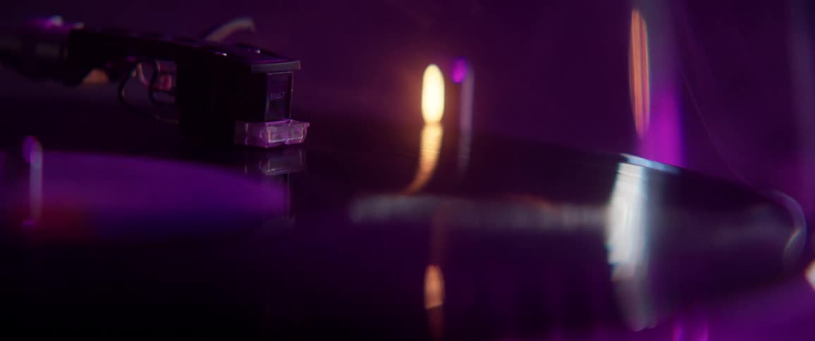 Record player with smoke and dark blue and purple lighting