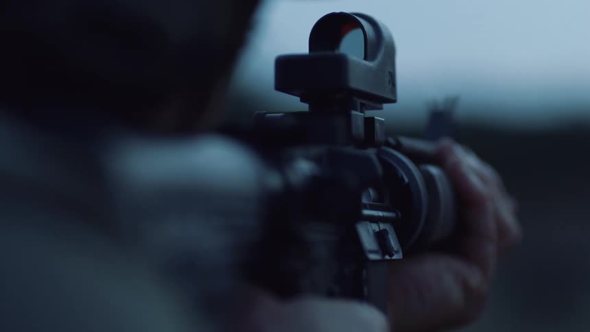 A soldier aiming his rifle